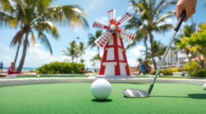 Mini-golf windmill obstacle in sunny Florida with a golf ball rolling toward the hole, palm trees and water blurred in the background.